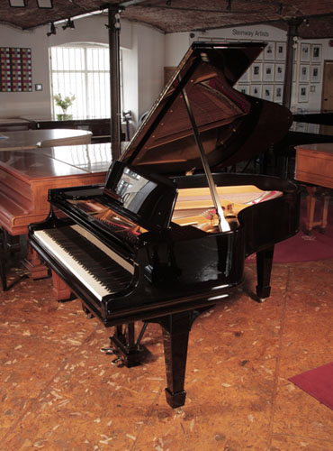 Rebuilt, 1910, Steinway  & Sons Model O Grand Piano with a  Black Case and Spade Legs