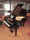 Piano for sale. Rebuilt, 1910, Steinway Model O grand piano for sale with a black case and spade legs. Piano has an eighty-eight note keyboard and a two-pedal lyre.