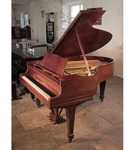 A 1927, Steinway Model O grand piano for sale with a figured, mahogany case and spade legs. Piano has an eighty-eight note keyboard and a two-pedal lyre.