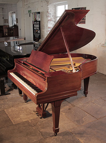 A 1927, Steinway Model O grand piano for sale with a figured, mahogany  case and spade legs. Piano has an eighty-eight note keyboard and a two-pedal lyre.