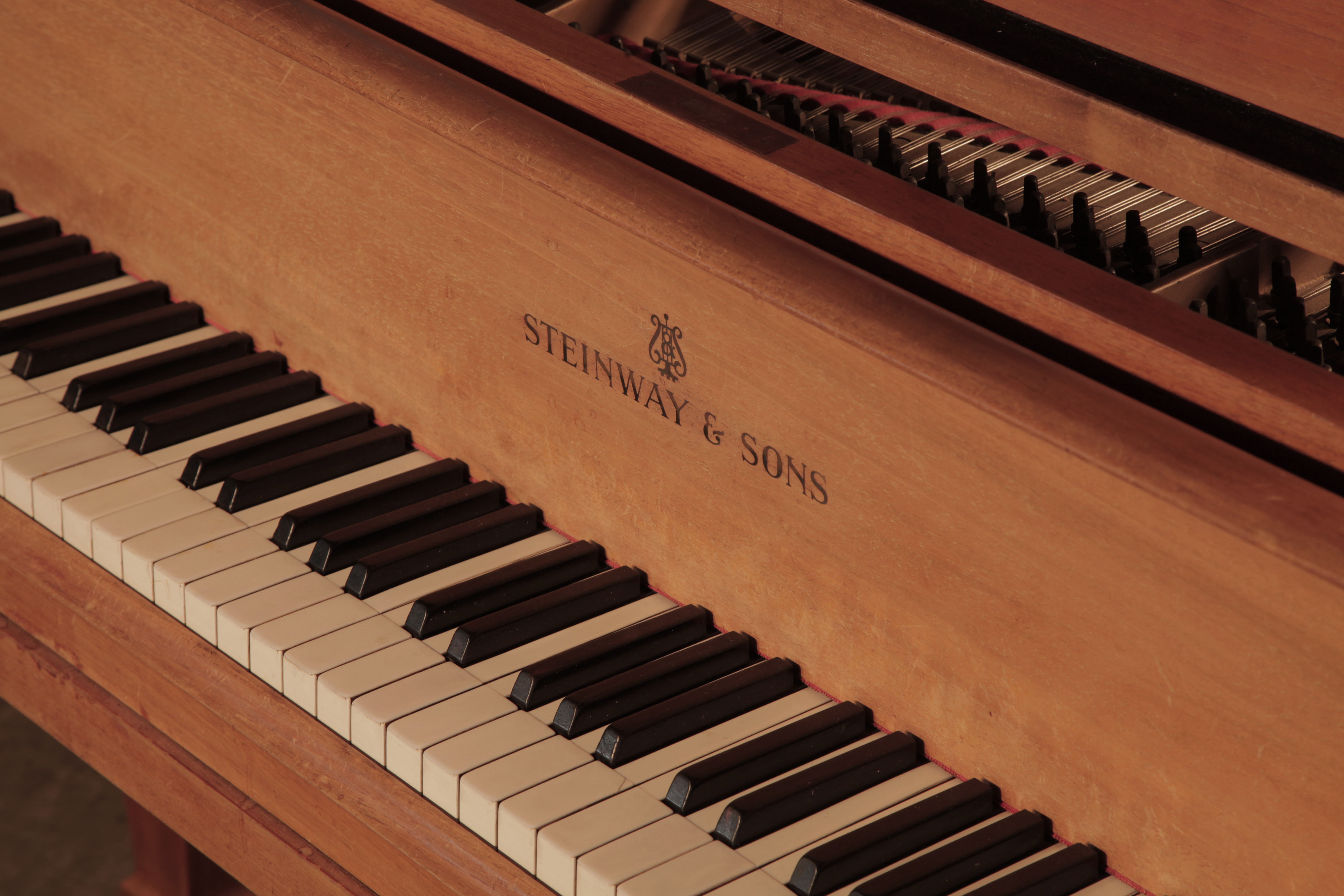 Steinway manufacturer's name inlaid on fall We are looking for Steinway pianos any age or condition.