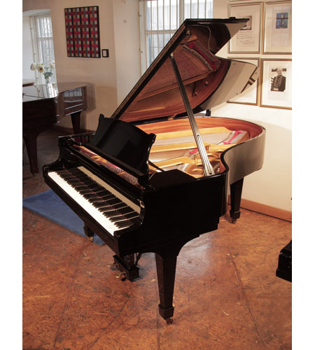Rebuilt, 1975, Steinway Model O grand piano for sale with a black case and spade legs. Piano has an eighty-eight note keyboard and a two-pedal lyre. 