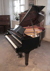 Rebuilt, 1937, Steinway Model S baby grand piano with a black case and spade legs