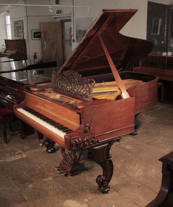 Restored, Rococo style, 1877, Steinway & Sons Style 1 grand piano for sale with a rosewood case, filigree music desk and ornately carved, reverse scroll legs.  Piano has an eighty-five note keyboard and a two-pedal lyre. 