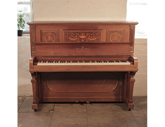 A 1904, Steinway upright piano for sale with a polished, rosewood case and brass fittings. Cabinet features inlaid panels in a Neoclassical design.  Piano has an eighty-eight note keyboard and two pedals. 