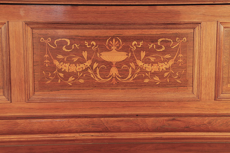 Steinway  inlaid ffront panel in a Neoclassical design .