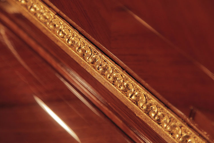 Steinway gold cabinet moulding detail