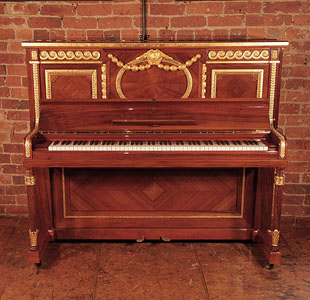 A 1912, Steinway Vertegrand upright piano for sale with a quartered walnut case. Cabinet features carvings of rolling waves, strapwork and beading highlighted with gold. Piano has spiral, fluted Sheraton legs also carved with waves and leaves, highlighted with gold. Piano was commissioned for the RMS Olympic Liner, sister to the Titanic. 