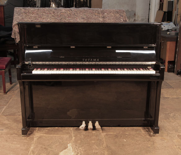 Pre-owned, Toyama TX-19 upright piano for sale with a black case and brass fittings