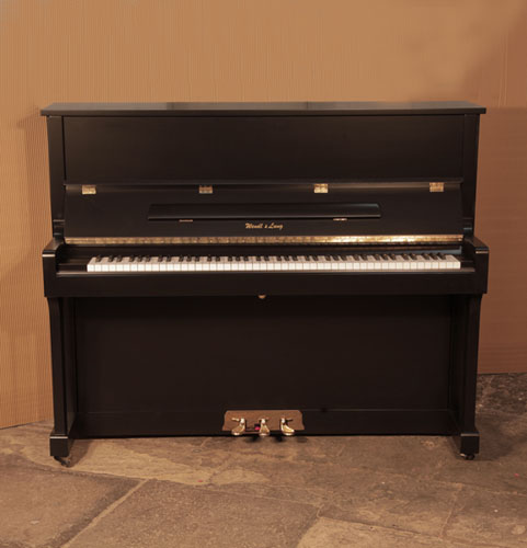 A 2008, Wendl and Lung model 122 universal upright piano for sale with a satin, black case and brass fittings
