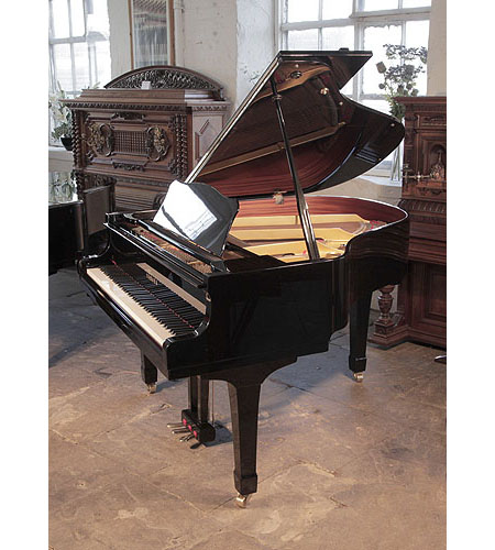 Reconditioned, 1987, Yamaha G1 baby grand piano for sale with a black case and square, tapered legs Piano has an eighty-eight note keyboard and a two-pedal lyre. 