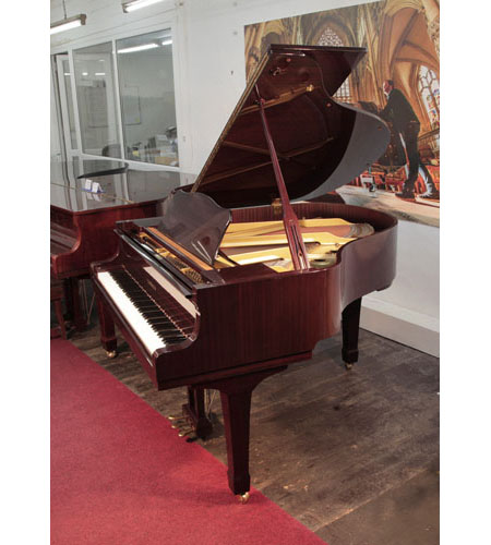 Reconditioned, 1994, Yamaha G1 baby grand piano with a mahogany case and spade legs. Piano has an eighty-eight note keyboard and a three-pedal lyre.
 
