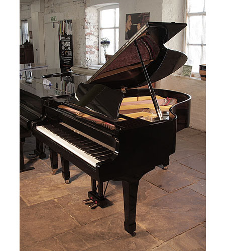 Reconditioned, 1975, Yamaha G2 grand piano for sale with a black case and spade legs. Piano has an eighty-eight note keyboard and a two-pedal lyre.  