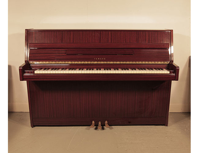 Pre-owned, 1984, Yamaha M5JR upright piano for sale with a mahogany case and brass fittings . Piano has an eighty-eight note keyboard and three pedals. 