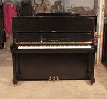 Reconditioned, 1994, Yamaha U1 upright piano with a black case and polyester finish. Piano has an eighty-eight note keyboard and three pedals. 