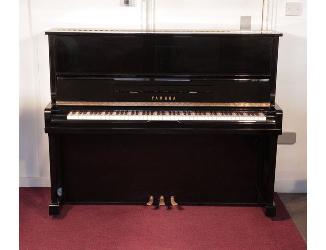 Reconditioned, 1990, Yamaha U10A upright piano with a black case and polyester finish. Piano has an eighty-eight note keyboard and three pedals.