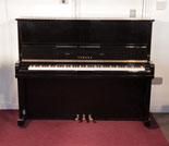 Piano for sale.  Reconditioned, 1990, Yamaha U10A upright piano with a black case and polyester finish. Piano has an eighty-eight note keyboard and three pedals. 