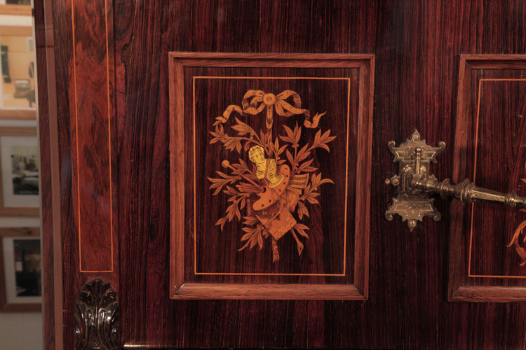 Ascherburg side panel inlaid with an artists palette, a bust and foliage hanging from a bow