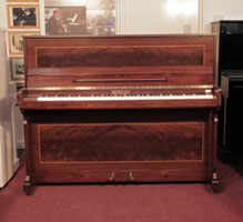 Reconditioned, 1988, Bentley upright piano with a mahogany case with flame mahogany panels bordered with satinwood stringing 