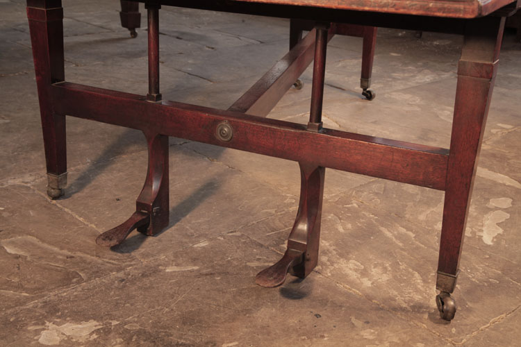 Broadwood  legs  and wooden pedals attached to a cross stretcher