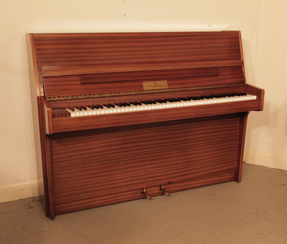 Pre-owned, 1982, Broadwood upright piano with a polished, mahogany case.  Piano has an eighty-eight note keyboard and two pedals.