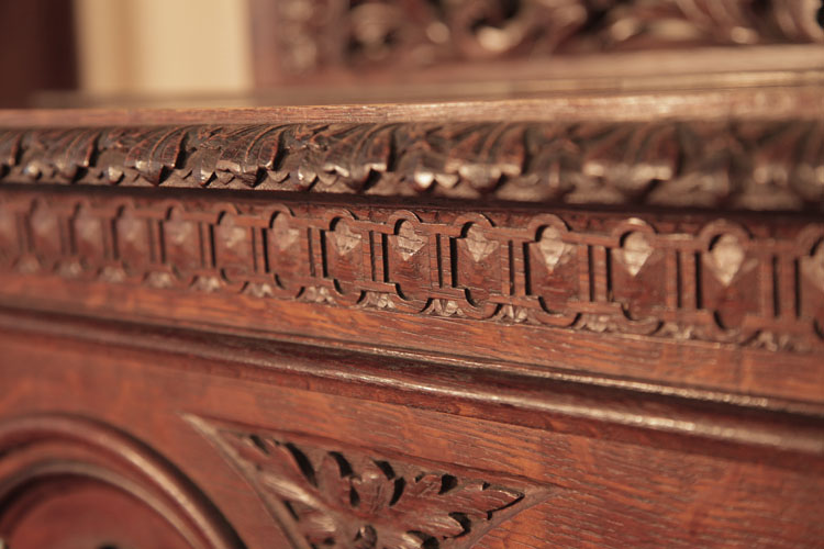 Francke carved strapwork border along the top of the cabinet