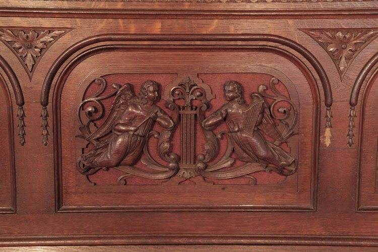 Francke  front panel carved with angels with musical instruments and a central lyre