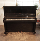 Piano for sale. A 1938, Steinway Model K upright piano with a black case and indented front panels. Piano has an eighty-eight note keyboard and two pedals.
