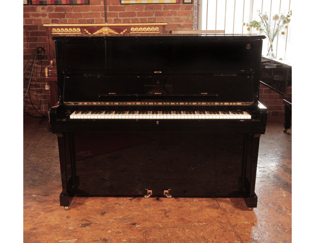 Reconditioned, 2002, Steinway Model V upright piano with a polished, black case with brass fittings. Piano frame signed by Lang Lang. Piano has an eighty-eight note keyboard and two pedals