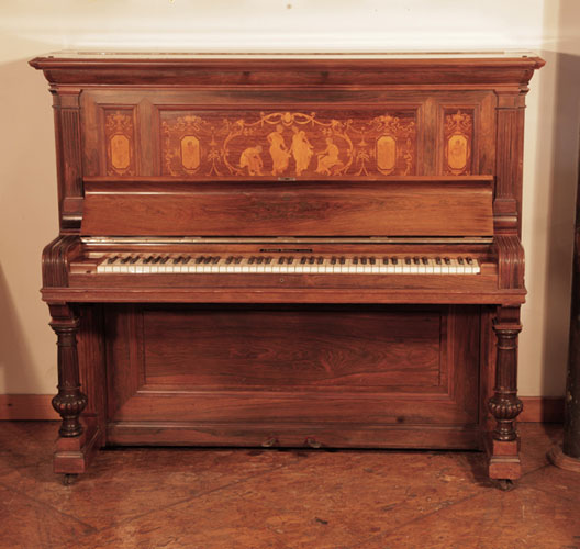 Reconditioned, 1894, Steinway upright piano for sale with a polished, rosewood case and panels inlaid in wih dancing ladies and putti. Piano has an eighty-five note keyboard and two pedals  