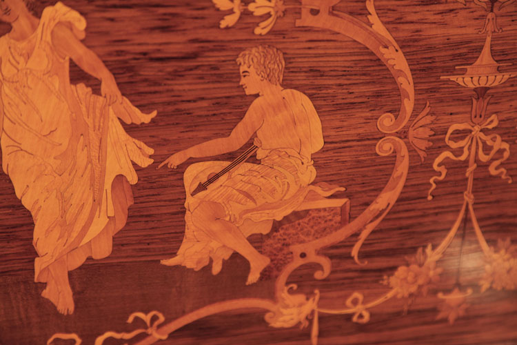 Steinway front panel inlay detail of a seated man with a lute