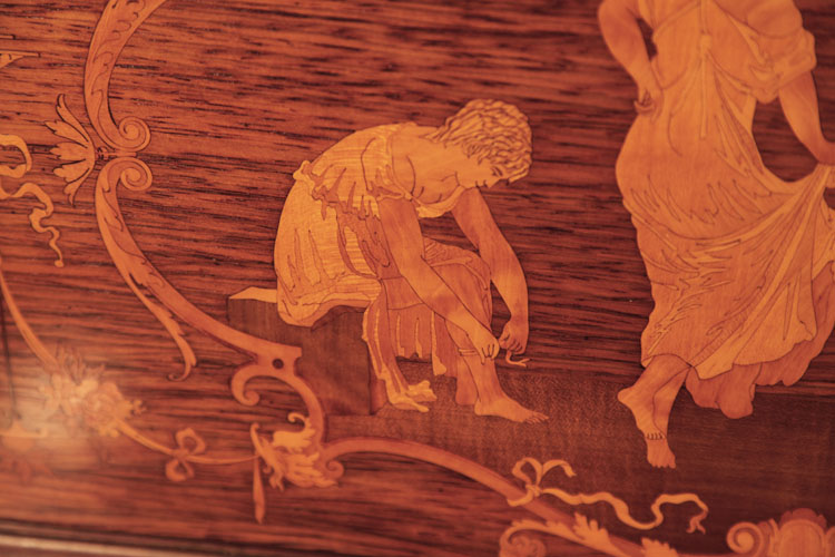 Steinway  inlay detail of a seated male