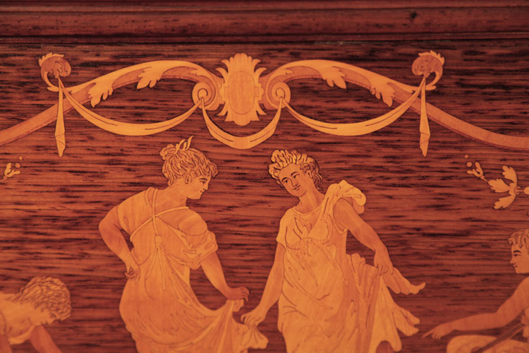 Steinway front panel inlay detail of the scrolling acanthus border, swagged fabric and central cartouche