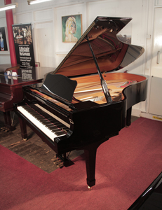  Reconditioned, 2000, Yamaha C6 grand piano for sale with a black case and spade legs