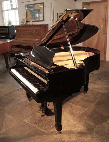 Reconditioned,  1982, Yamaha G2 grand piano for sale with a black case and spade legs. Piano has an eighty-eight note keyboard and a two-pedal lyre. 