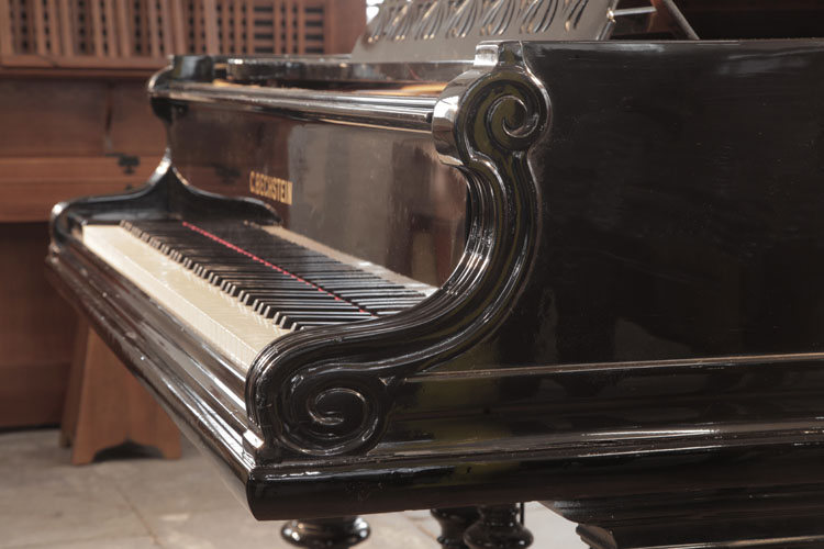 Bechstein Model D  piano cheek with a carved, C-scroll and dual linear case moulding that wraps around the cabinet base