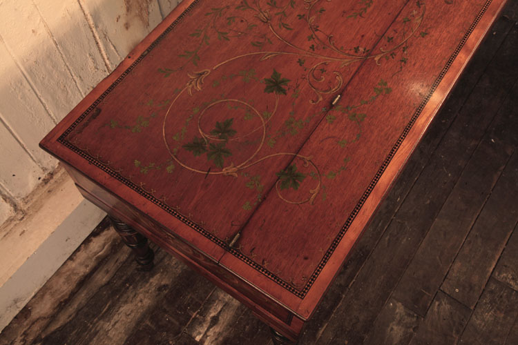Piano lid featuring hand-painted detail of tendrils and vine leaves