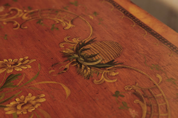Hand-painted detail of lid featuring a beehive, interlacing curvilinear C-scrolls, flowers and foliage 