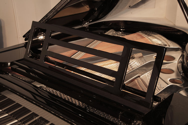 Feurich model 179 open work music desk in a rectangular slatted design