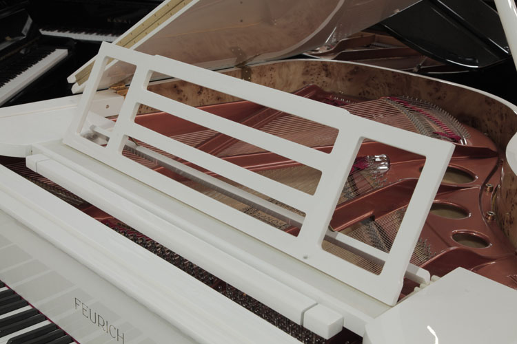 Feurich openwork music desk in a slatted, rectangular design with adjustable LED lighting