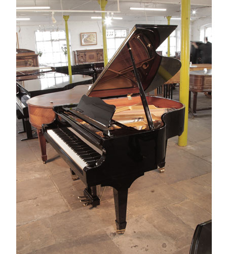 A 2017, W. Hoffmann V158 baby grand piano for sale in black gloss. Piano has an eighty-eight note keyboard and a three-pedal lyre.