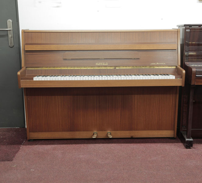 Pre-owned, 1970, Knight upright piano with a mahogany case and cut-out music desk. Piano has an eighty-eight note keyboard and two pedals.