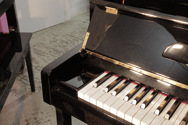 Pinkham piano cheek with slow fall mechanism