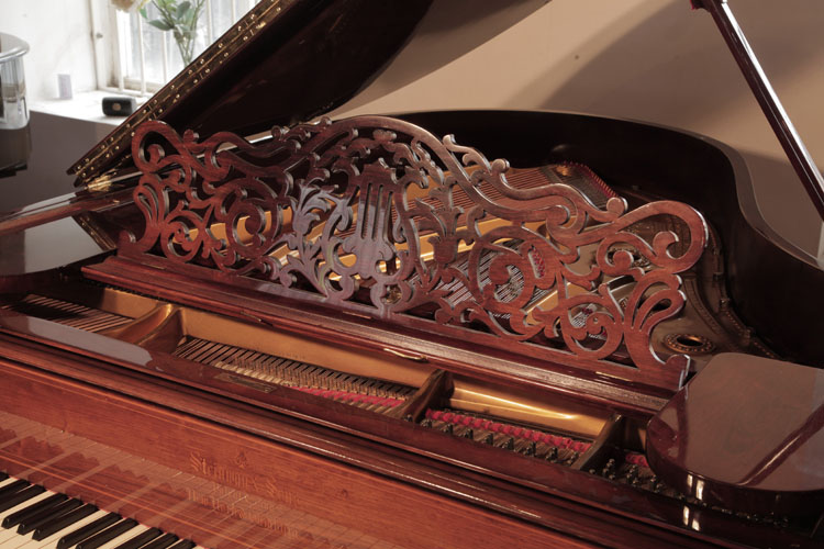 Steinway piano music desk in a cut-out arabesque design with central lyre motif