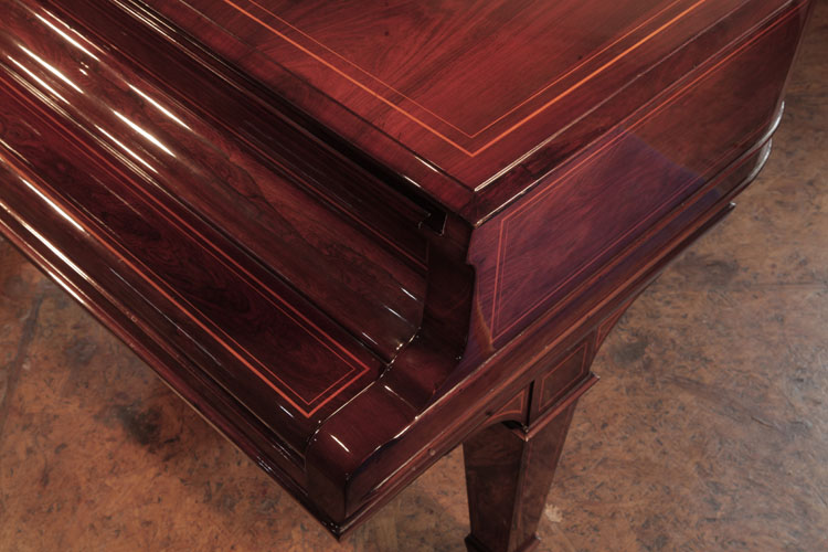 Steinway piano lid in exquisite rosewood wood grain with satinwood stringing accents