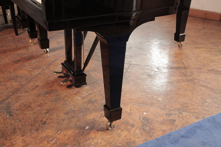 Steinway spade piano leg with brass casters