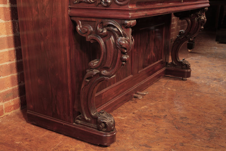 Steinway reverse scroll leg with carved acanthus detail and scroll feet