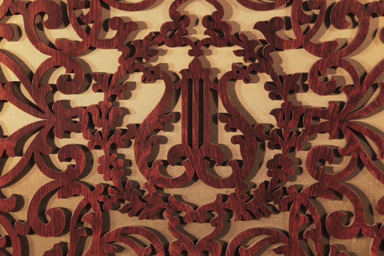 Openwork front panel in an arabesque design with central lyre motif