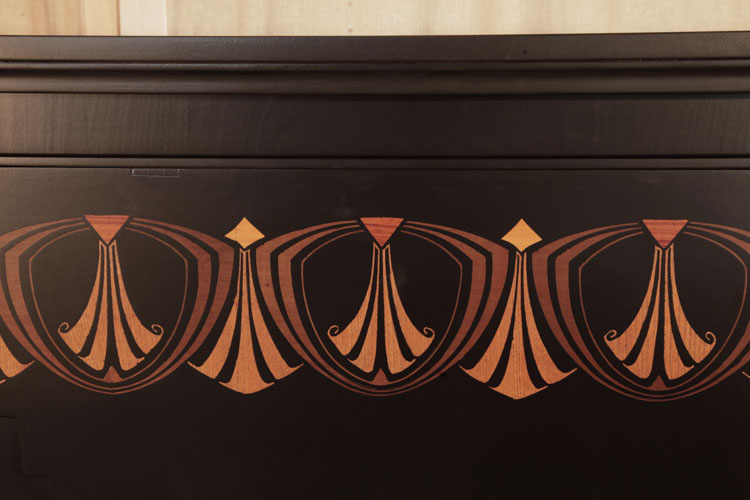 Seiler front panel inlaid with repeated, stylised fans within bold geometric, angular forms in contrasting woods