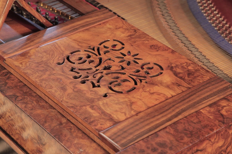 Cut-out stylised tendrils and flowers ornament on music desk